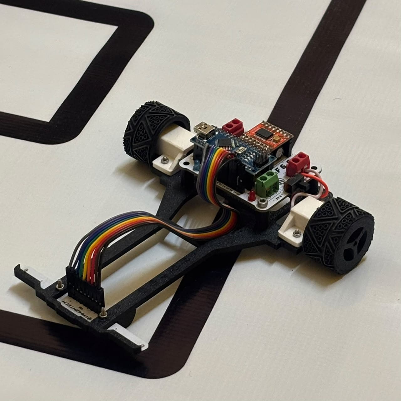 TTRC LF 6.0 line follower robot angled perspective view on competition track
